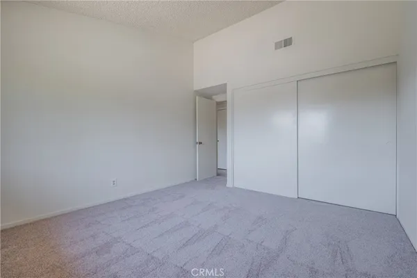a spacious bathroom with a granite countertop sink and a mirror
