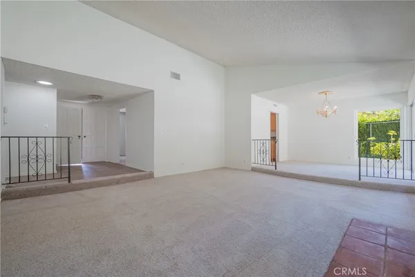 an empty room with a fireplace