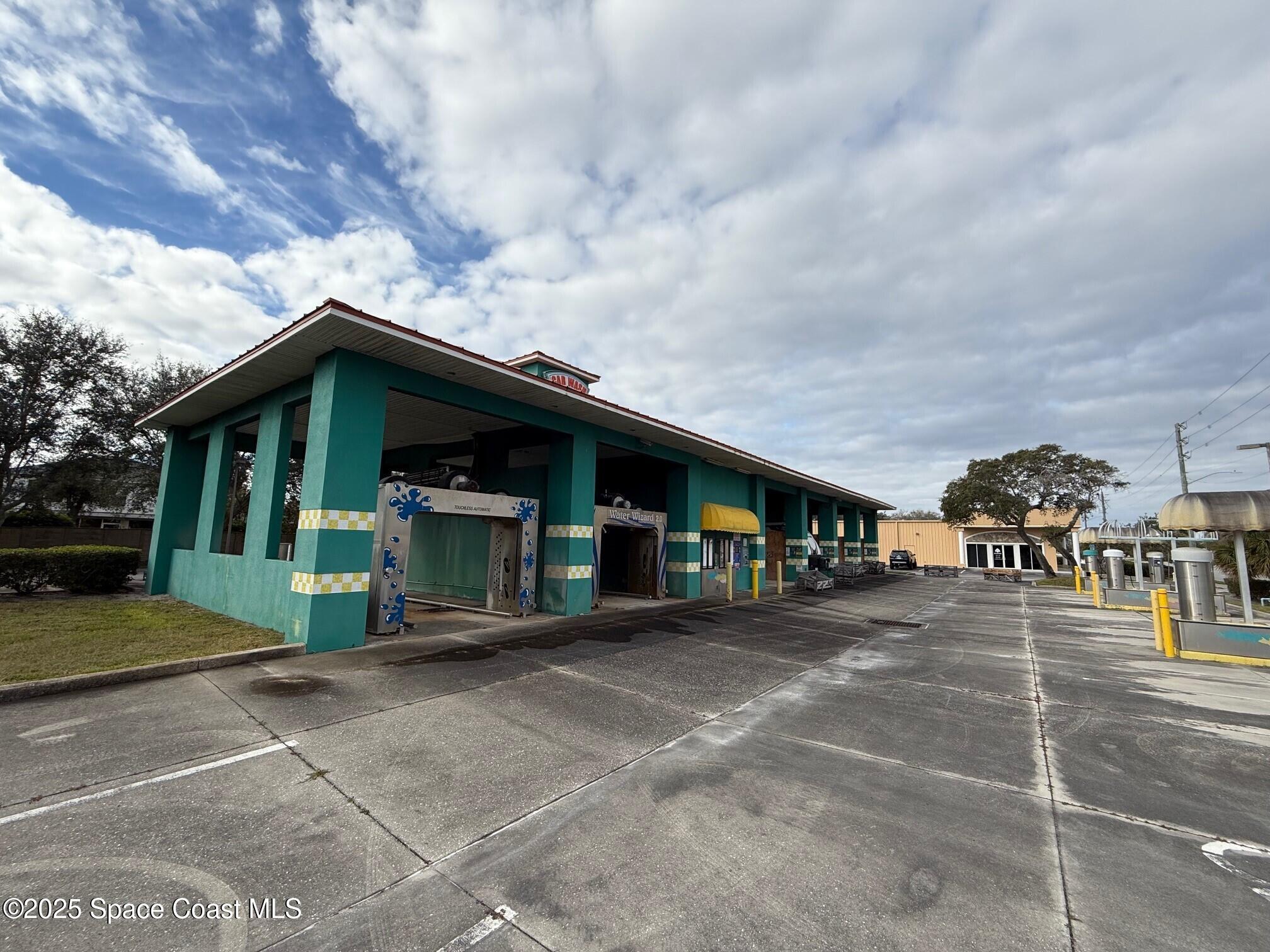 1301 Lake Washington Road Melbourne, FL 32935 - Photo 11 of 13 a view of a car park in front of house