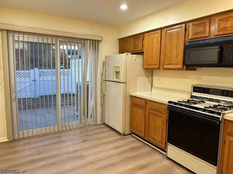 604 Bayley Court Bridgewater, NJ 08807 - Photo 3 of 15 a kitchen with stainless steel appliances granite countertop a refrigerator stove and microwave
