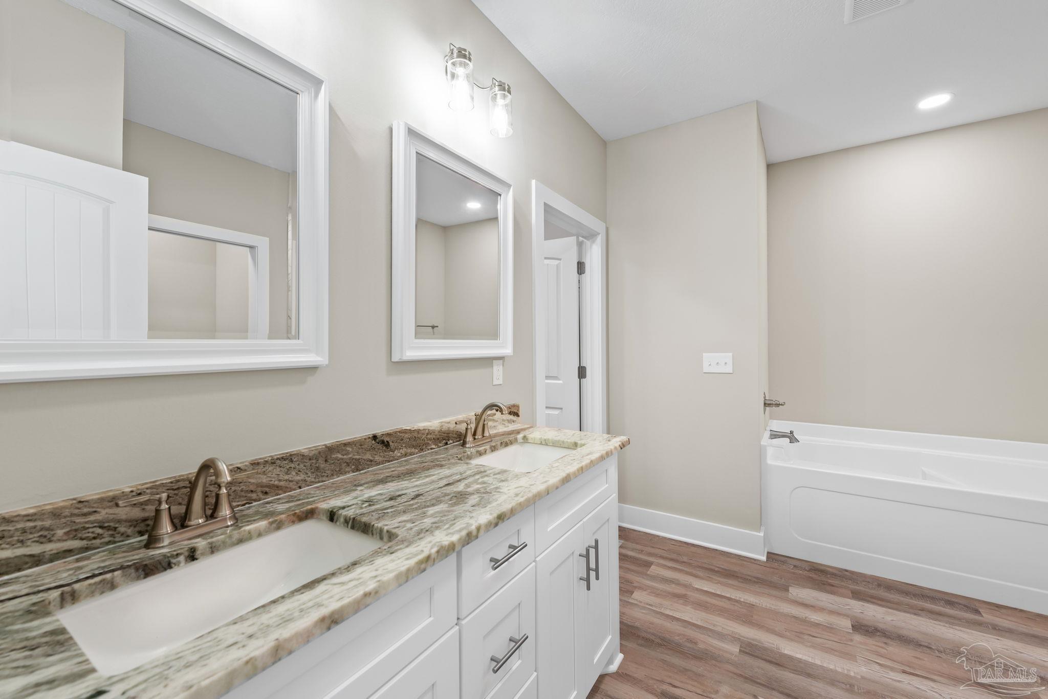 8261 Larson Lane Milton, FL 32583 - Photo 33 of 47 a bathroom with a sink and a mirror