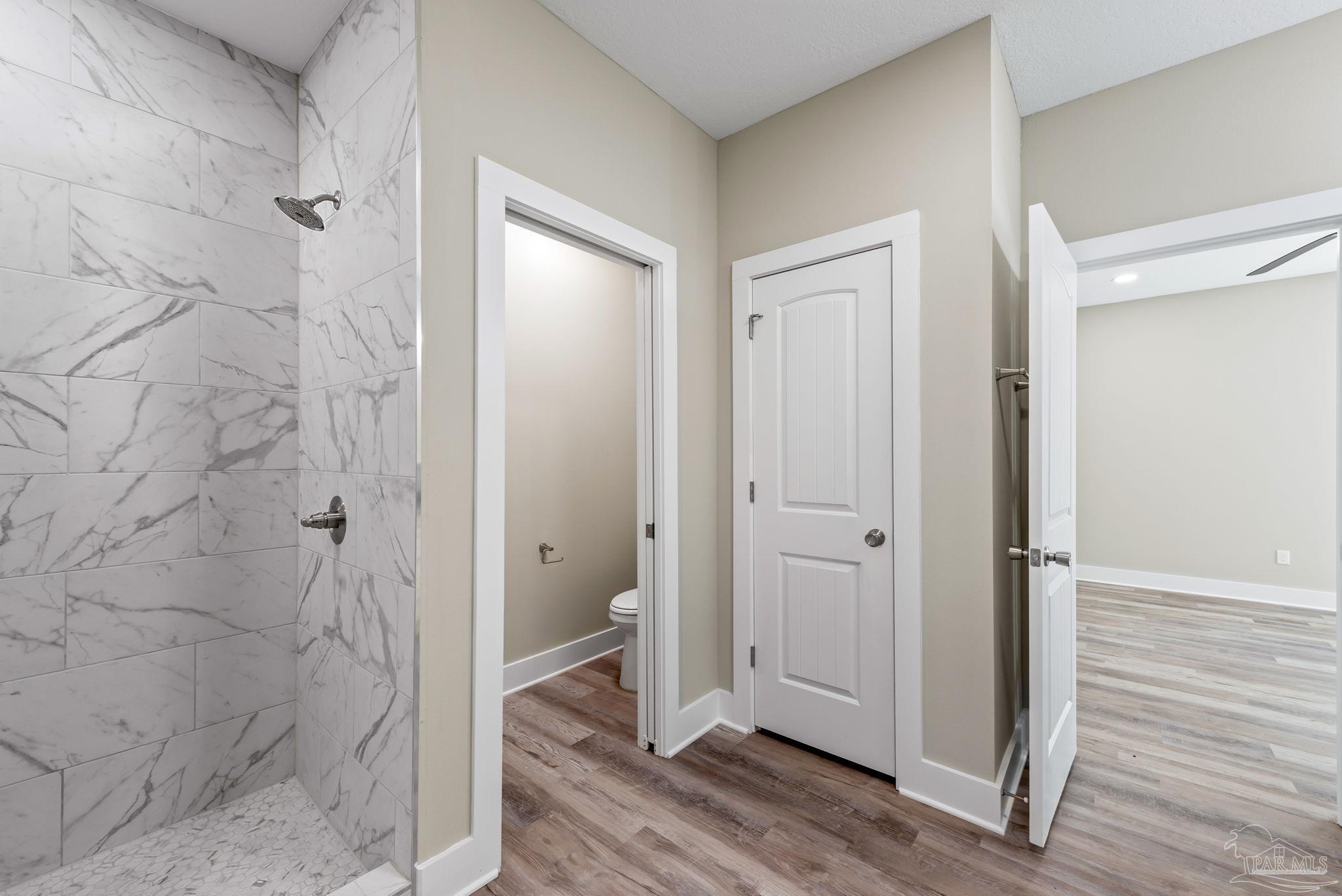 8261 Larson Lane Milton, FL 32583 - Photo 36 of 47 a bathroom with a granite countertop shower