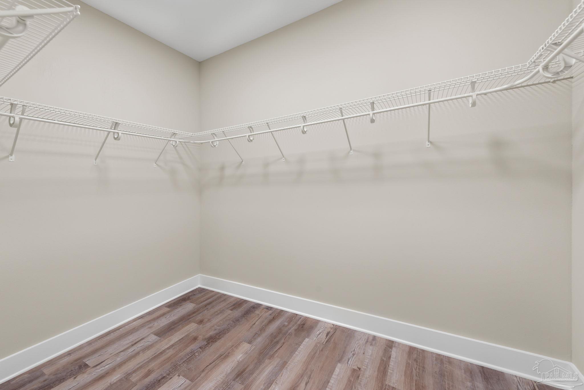 8261 Larson Lane Milton, FL 32583 - Photo 37 of 47 a view of a room with racks on the wall