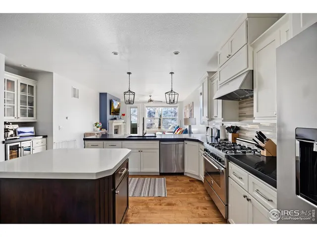 a view of a kitchen with appliances and a counter top space