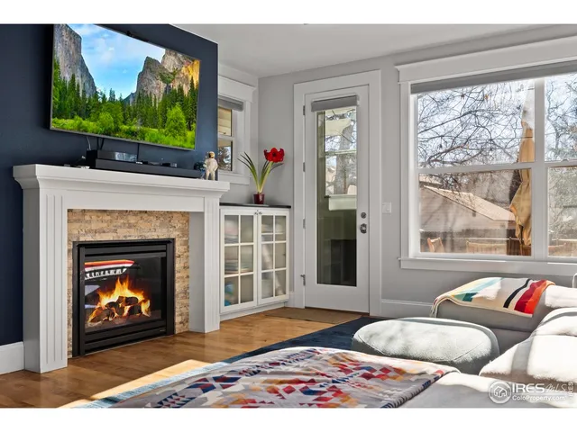 a bedroom with a bed and a fireplace