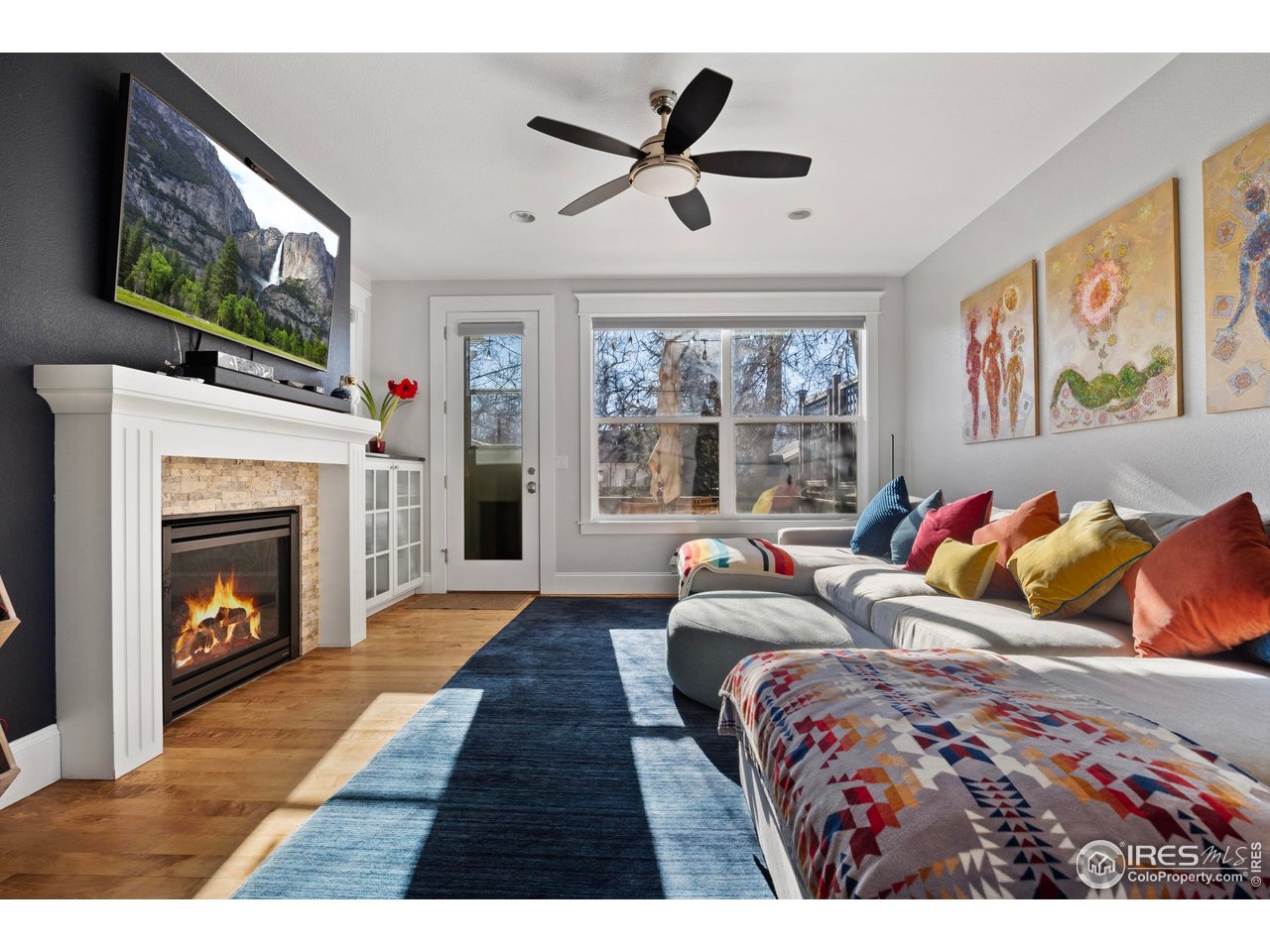 1201 Juniper Court Fort Collins, CO 80521 - Photo 20 of 50 a bedroom with a bed and a fireplace