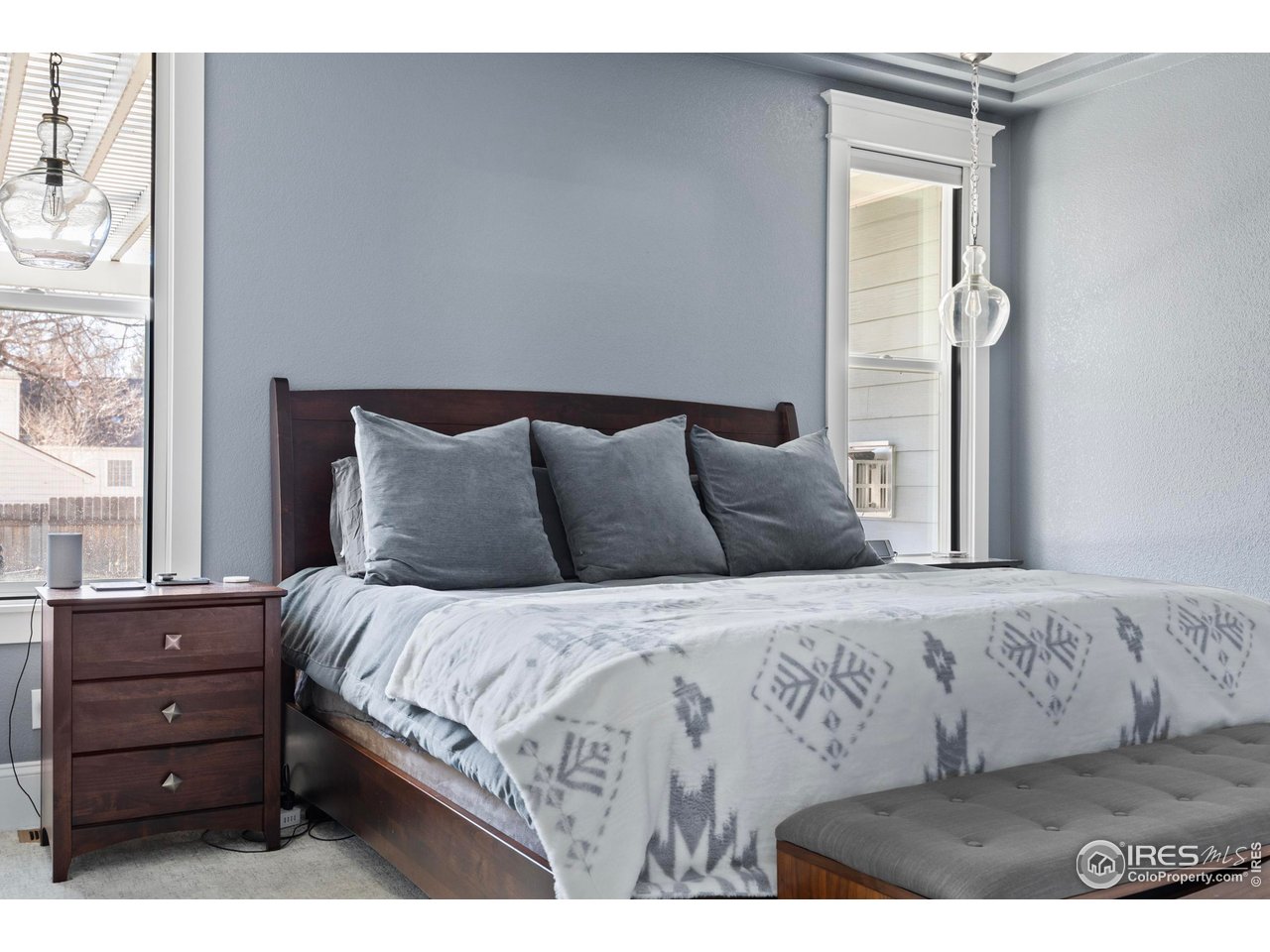 1201 Juniper Court Fort Collins, CO 80521 - Photo 22 of 50 a bedroom with a bed and a window