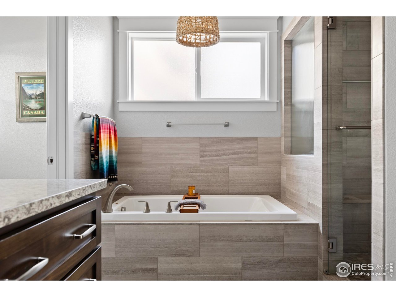 1201 Juniper Court Fort Collins, CO 80521 - Photo 25 of 50 a bathroom with a bathtub and a sink