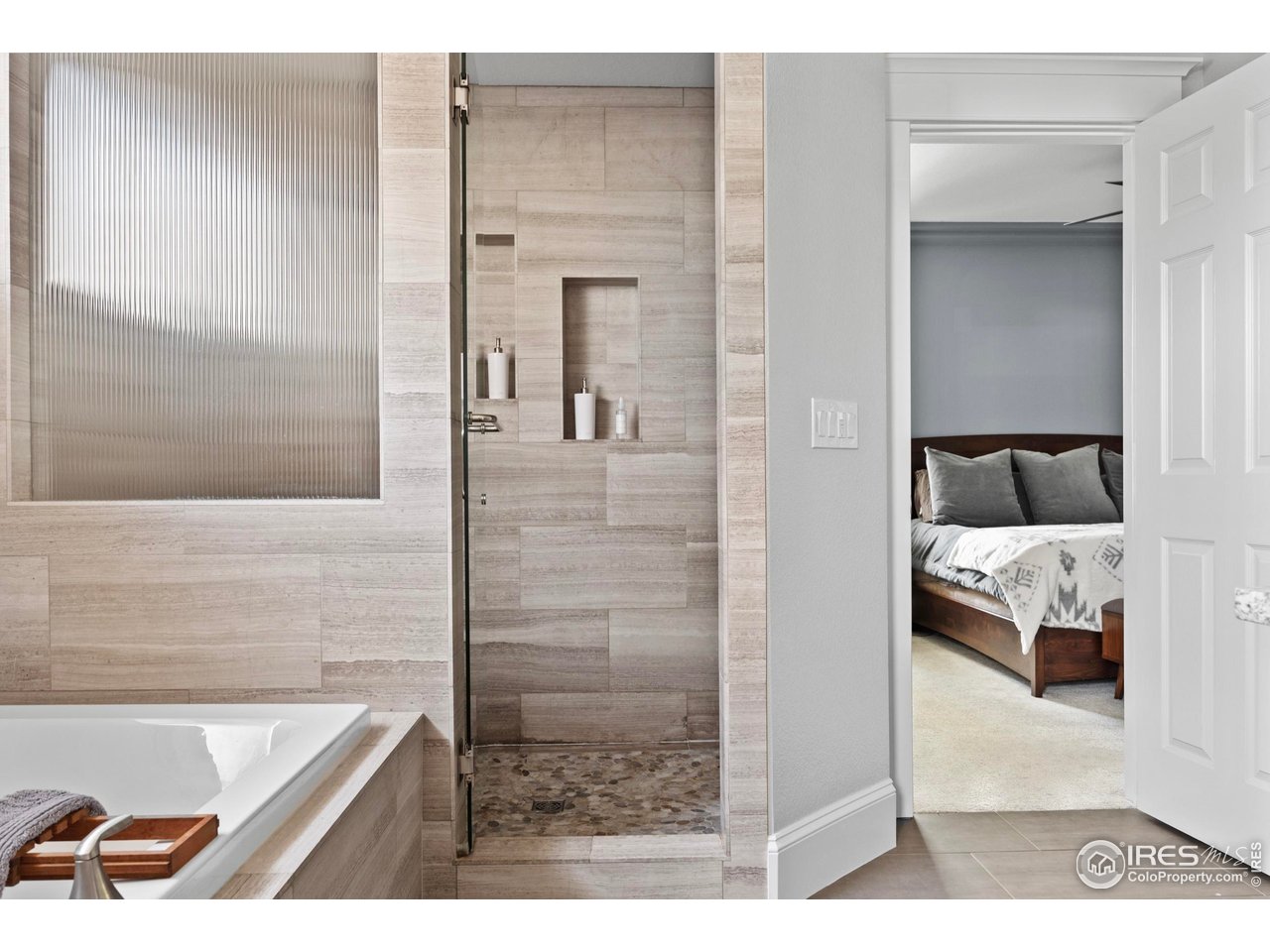 1201 Juniper Court Fort Collins, CO 80521 - Photo 26 of 50 a en suite bathroom with a granite countertop tub and a shower