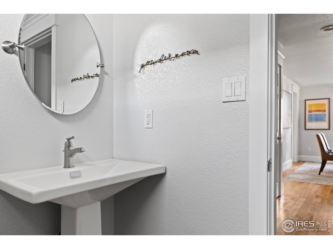1201 Juniper Court Fort Collins, CO 80521 - Photo 28 of 50 a bathroom with a sink and a mirror