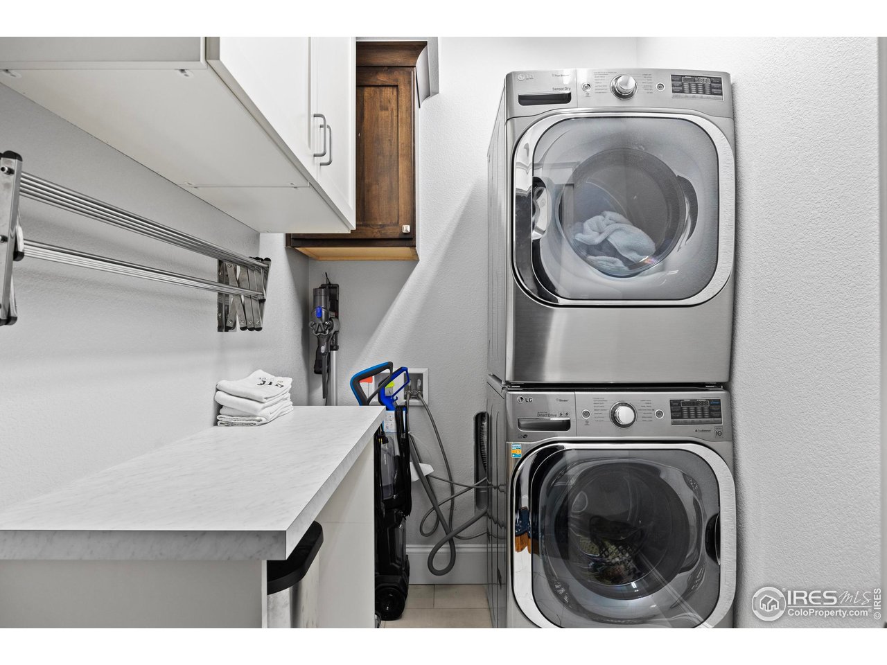 1201 Juniper Court Fort Collins, CO 80521 - Photo 29 of 50 a utility room with dryer and washer