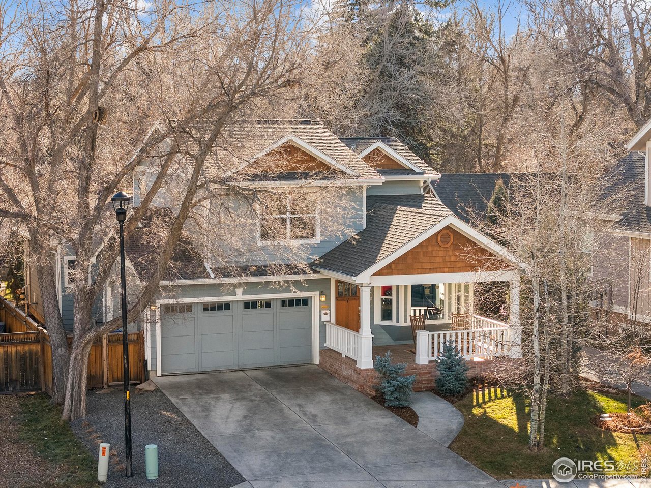 1201 Juniper Court Fort Collins, CO 80521 - Photo 3 of 50 a front view of a house with a yard
