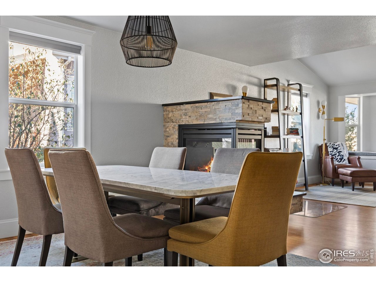 1201 Juniper Court Fort Collins, CO 80521 - Photo 8 of 50 a view of a dining room with furniture and wooden floor