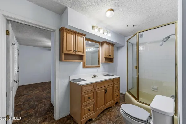 a utility room with cabinets washer and dryer