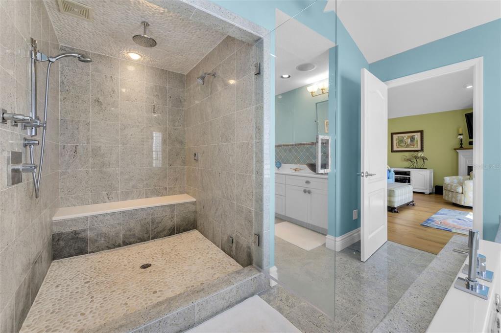13303 Gulf Lane Madeira Beach, FL 33708 - Photo 19 of 42 a bathroom with a tub and shower