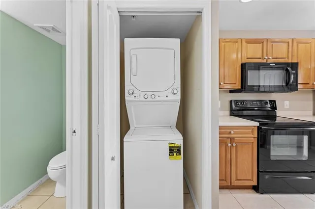 a bathroom with a toilet a sink and a mirror
