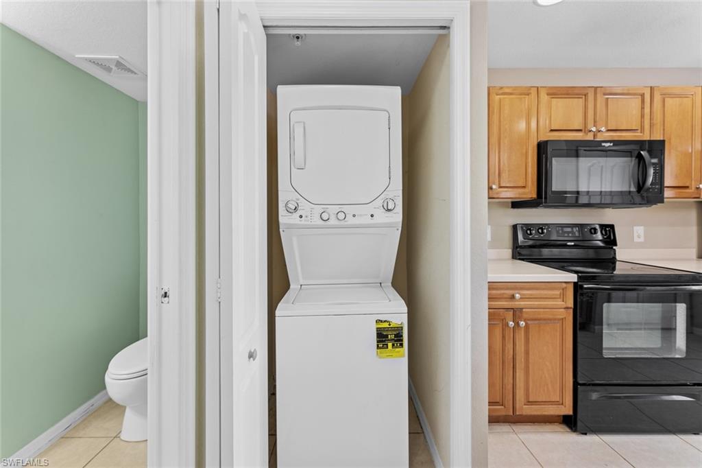 9450 Ivy Brook Run, Unit 602 Fort Myers, FL 33913 - Photo 14 of 34 a bathroom with a toilet a sink and a mirror