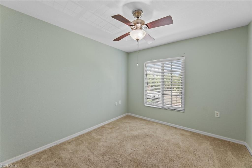 9450 Ivy Brook Run, Unit 602 Fort Myers, FL 33913 - Photo 16 of 34 an empty room with a window and a fan