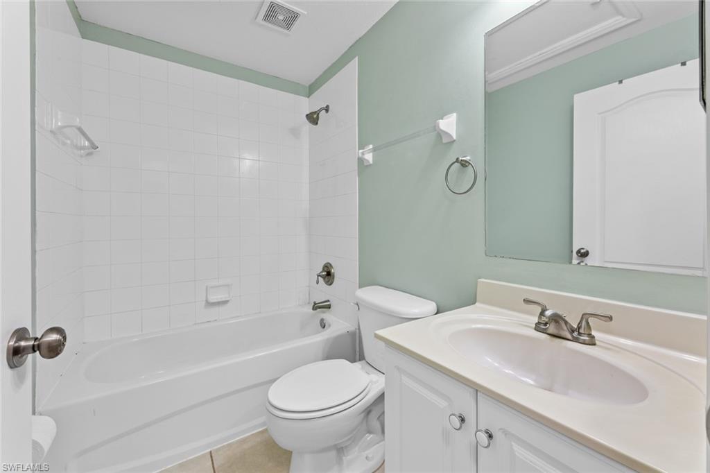 9450 Ivy Brook Run, Unit 602 Fort Myers, FL 33913 - Photo 18 of 34 a bathroom with a sink toilet and shower