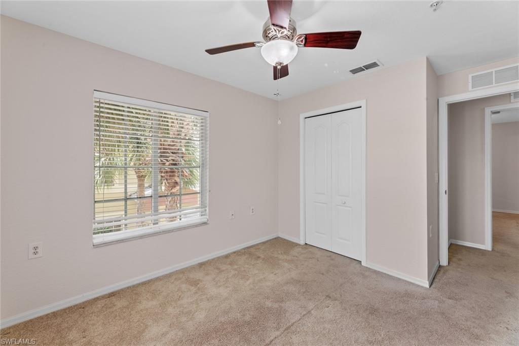9450 Ivy Brook Run, Unit 602 Fort Myers, FL 33913 - Photo 20 of 34 a view of an empty room with a window