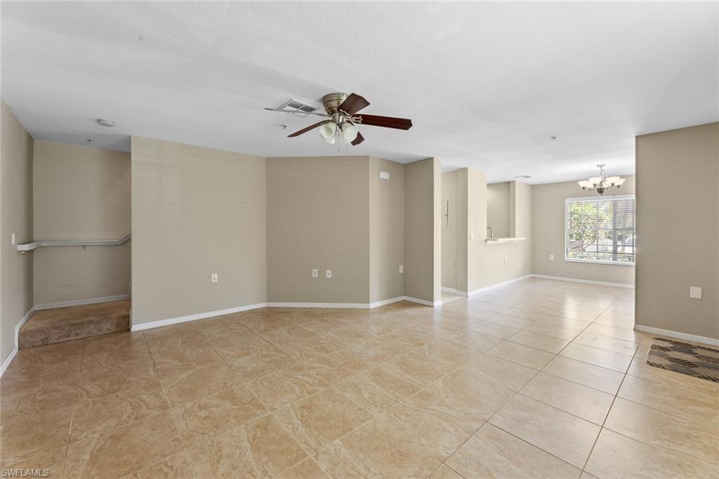 9450 Ivy Brook Run, Unit 602 Fort Myers, FL 33913 - Photo 2 of 34 a view of a livingroom with a walk in closet and window