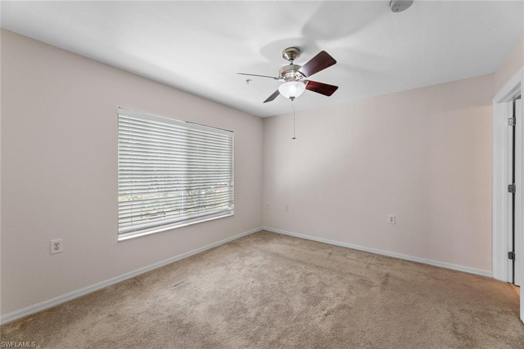 9450 Ivy Brook Run, Unit 602 Fort Myers, FL 33913 - Photo 21 of 34 a view of an empty room with a window