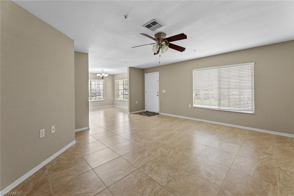9450 Ivy Brook Run, Unit 602 Fort Myers, FL 33913 - Photo 3 of 34 a view of an empty room with a window