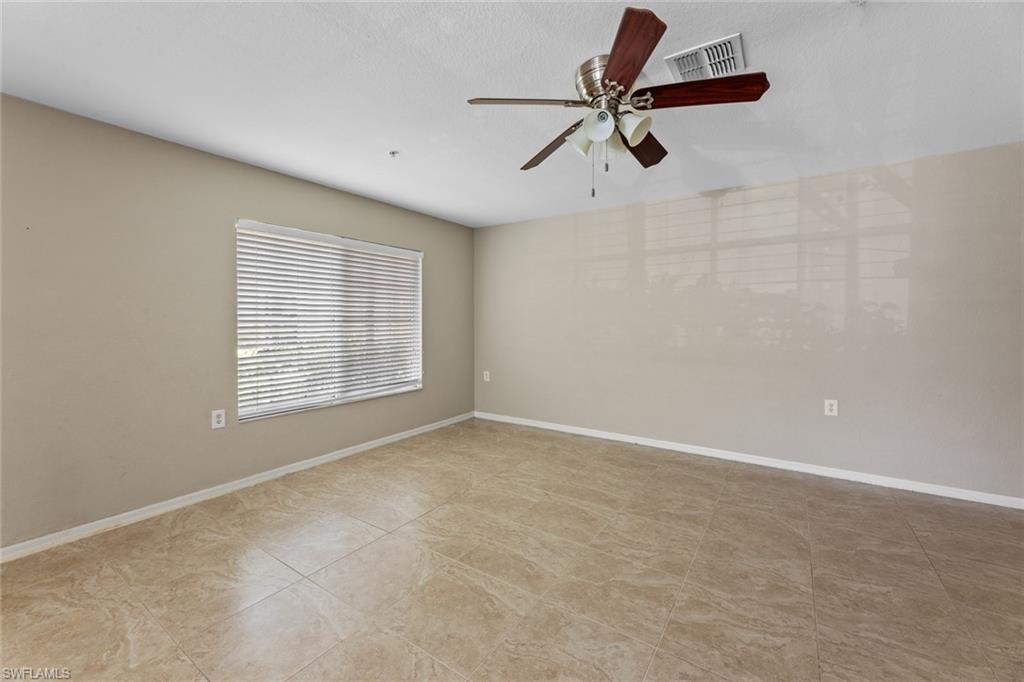 9450 Ivy Brook Run, Unit 602 Fort Myers, FL 33913 - Photo 5 of 34 a view of an empty room with a window