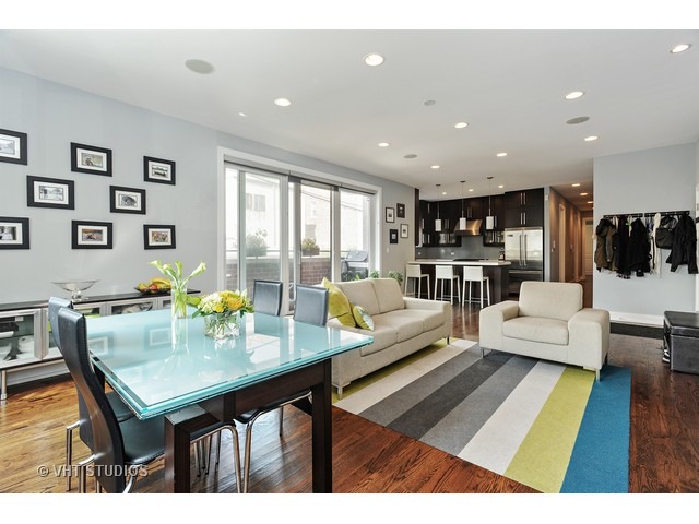 2144 West Rice Street, Unit 1W Chicago, IL 60622 - Photo 4 of 22 a living room with furniture and a table