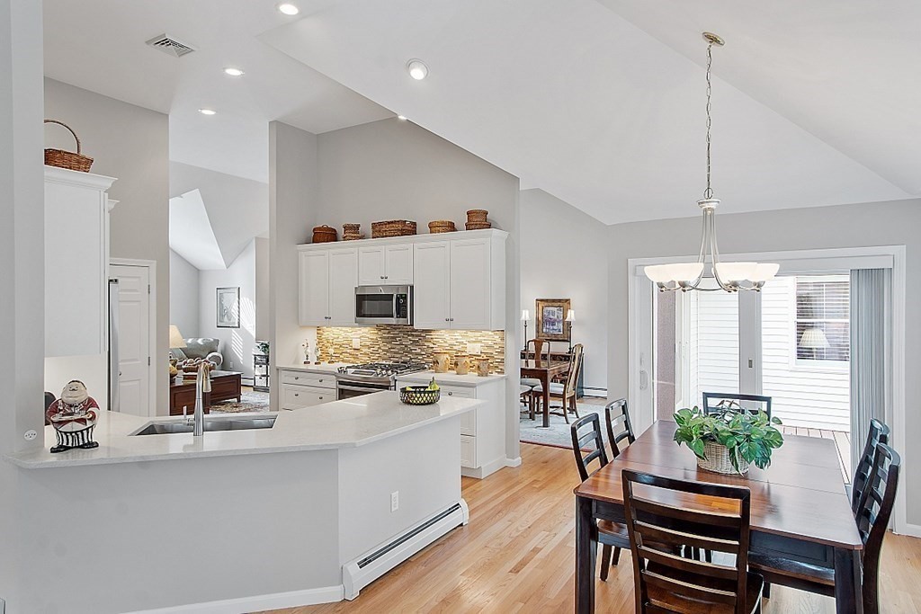 9 Joco Drive Tyngsborough, MA 01879 - Photo 14 of 38 a kitchen with counter top space appliances and furniture