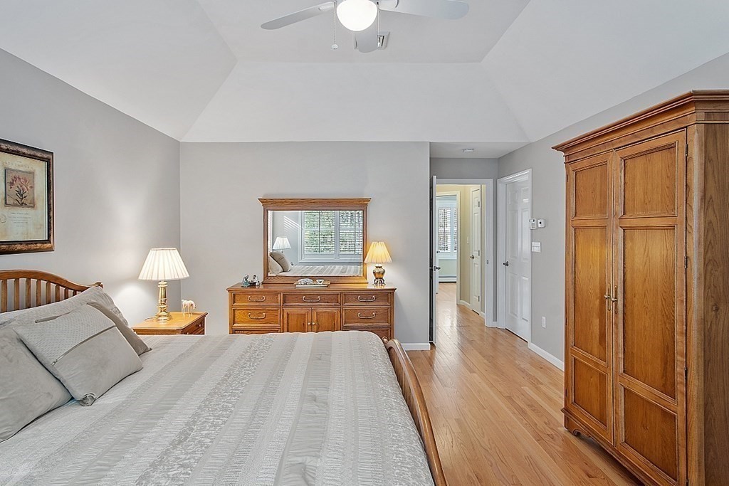 9 Joco Drive Tyngsborough, MA 01879 - Photo 20 of 38 a bed room with a bed and a chandelier