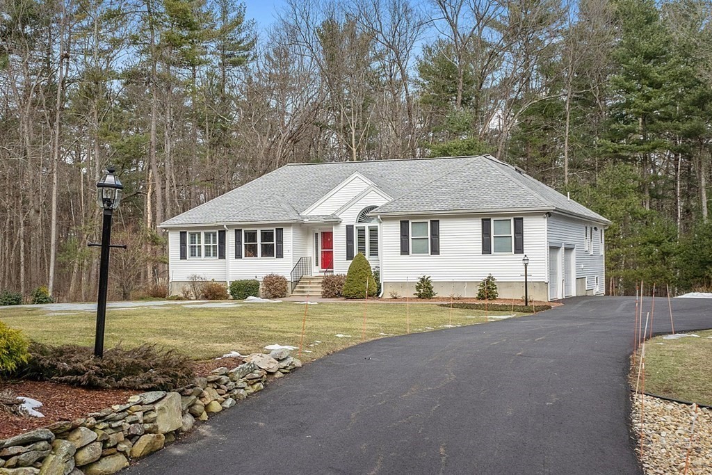 9 Joco Drive Tyngsborough, MA 01879 - Photo 3 of 38 a front view of a house with a yard