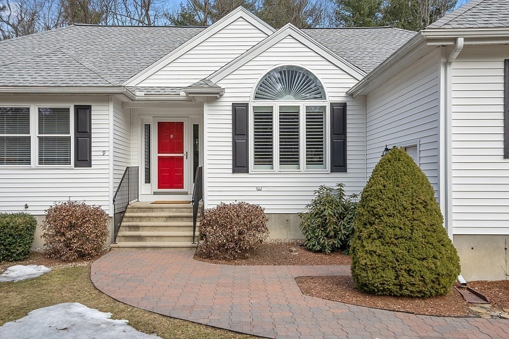 9 Joco Drive Tyngsborough, MA 01879 - Photo 34 of 38 a front view of a house with garden