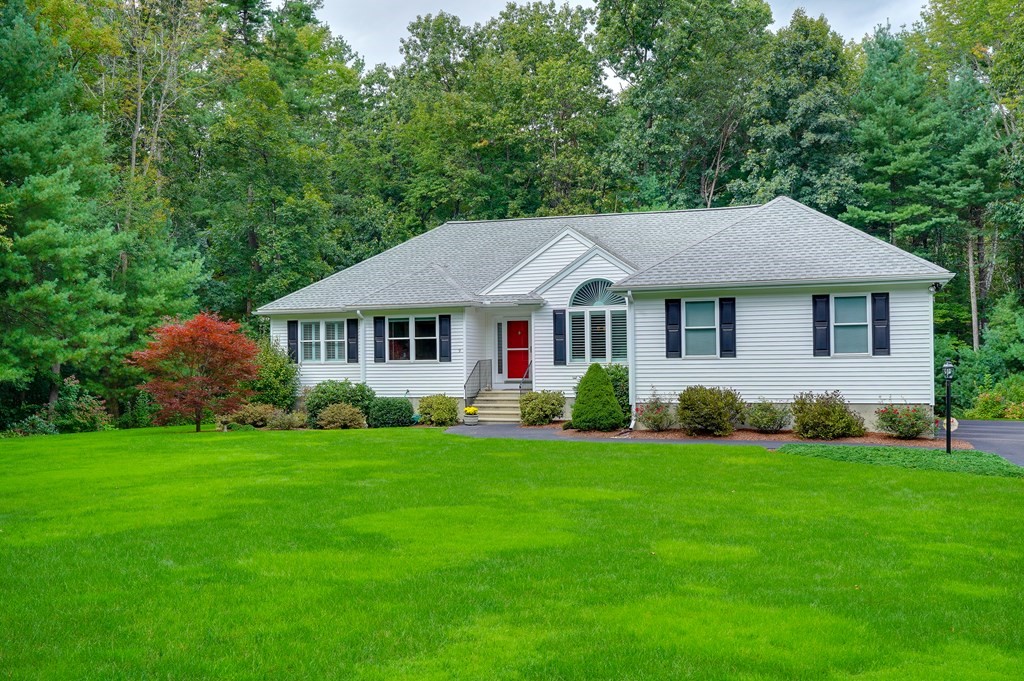 9 Joco Drive Tyngsborough, MA 01879 - Photo 35 of 38 a front view of a house with a garden