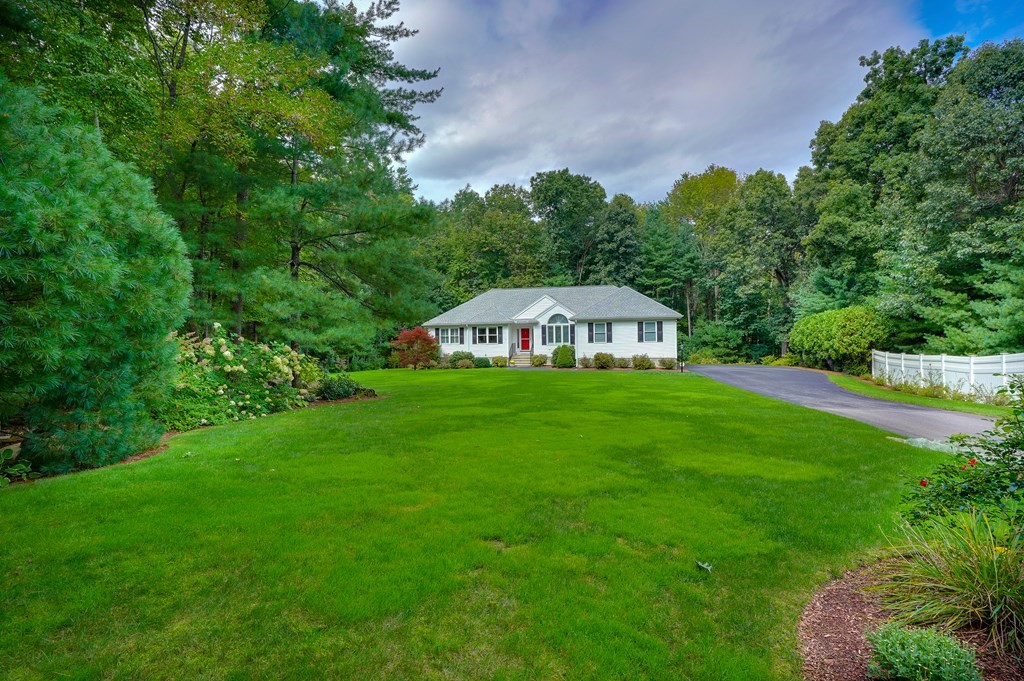 9 Joco Drive Tyngsborough, MA 01879 - Photo 38 of 38 a aerial view of a house with yard and trees in the background