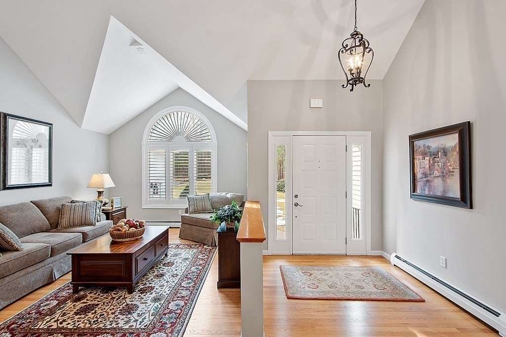9 Joco Drive Tyngsborough, MA 01879 - Photo 4 of 38 a living room with furniture and wooden floor