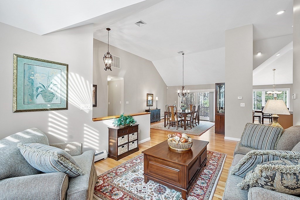 9 Joco Drive Tyngsborough, MA 01879 - Photo 7 of 38 a living room with furniture and a chandelier