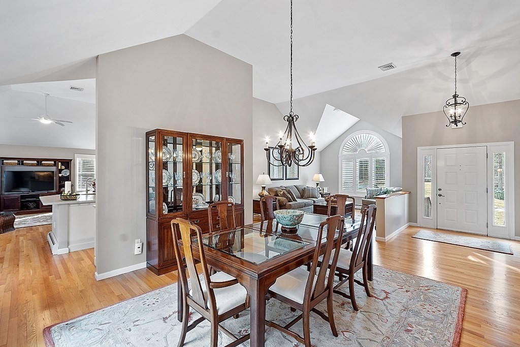 9 Joco Drive Tyngsborough, MA 01879 - Photo 9 of 38 a view of a dining room with furniture window and wooden floor