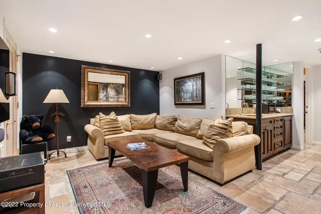 a bedroom with a bed and a night stand