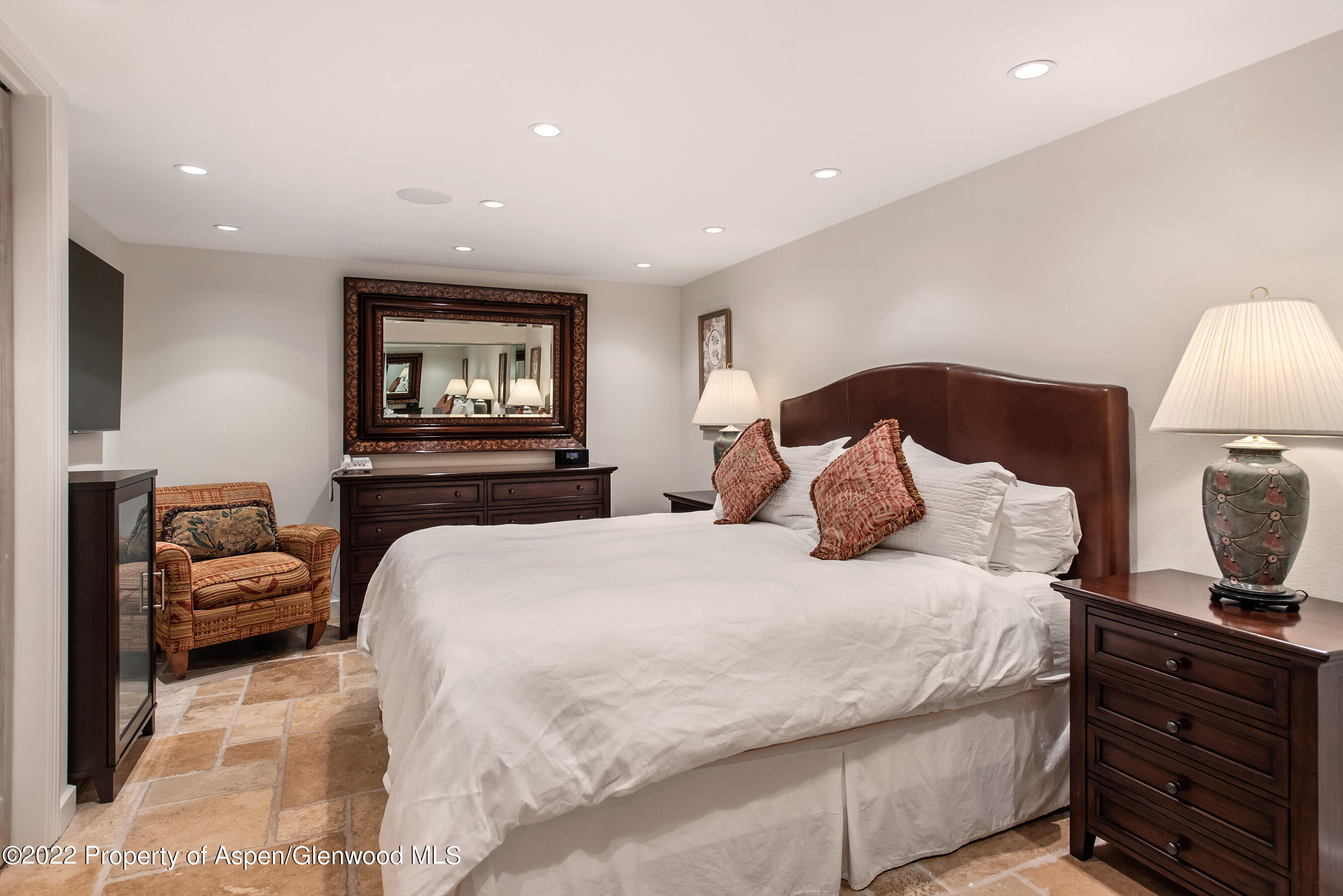 237 Gilbert Street Aspen, CO 81611 - Photo 19 of 28 a bedroom with a bed and a night stand