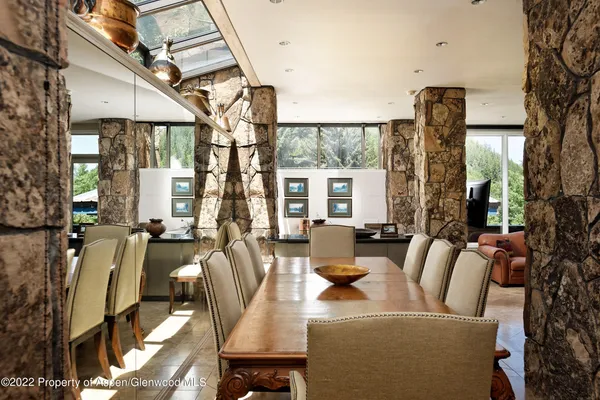 a view of a dining room with furniture window and outside view