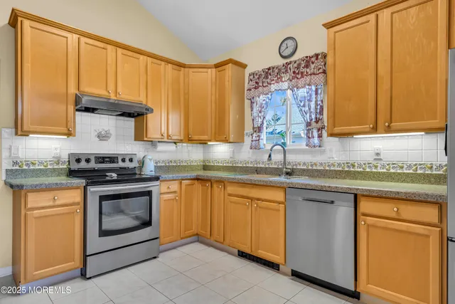 a dining room with furniture and a fireplace