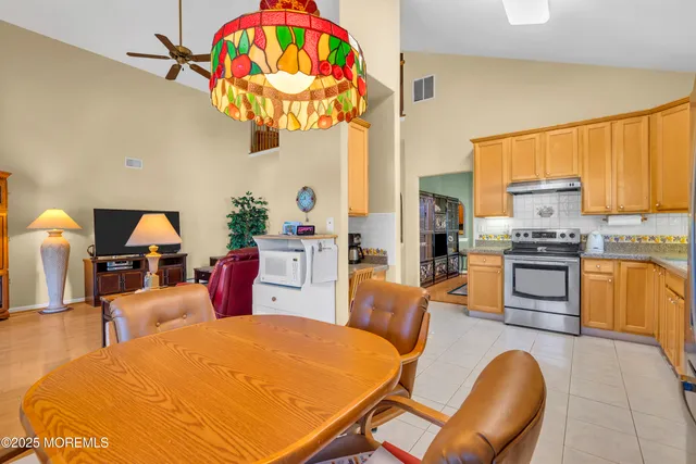 a view of work space with furniture and a window