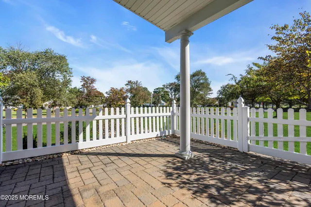 a living room with furniture and a baby crib