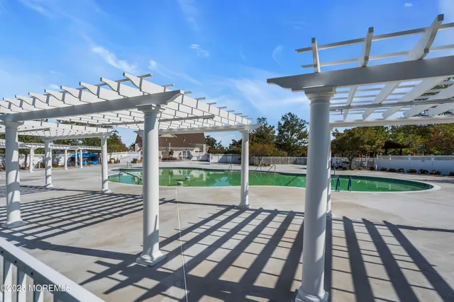 a view of a grassy field with trees