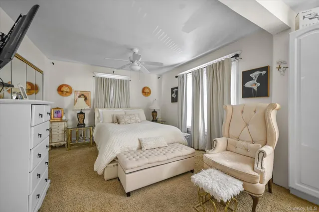 a spacious bedroom with a bed and a couch