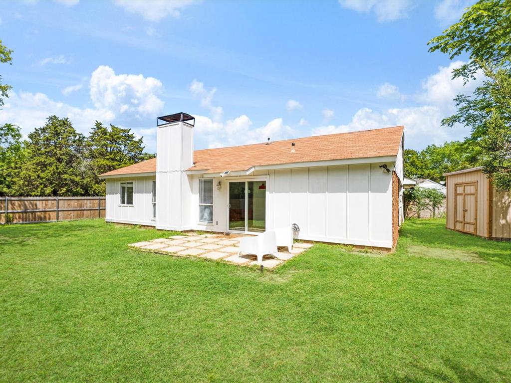6702 Umphress Road Dallas, TX 75217 - Photo 20 of 22 a front view of a house with a garden and yard