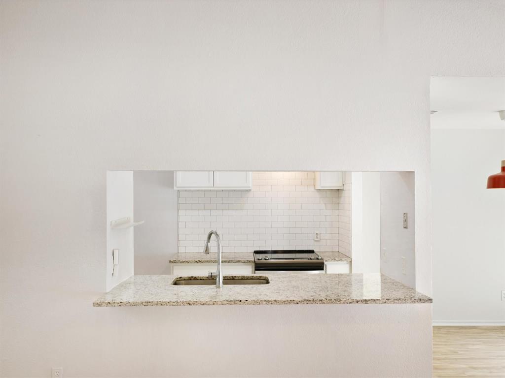6702 Umphress Road Dallas, TX 75217 - Photo 10 of 22 a view of kitchen with stainless steel appliances wooden floor and window