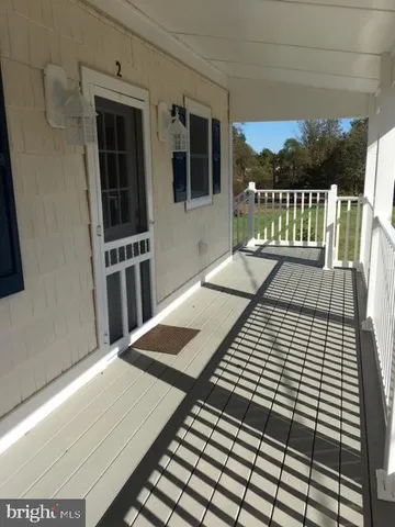 a view of balcony with wooden floor