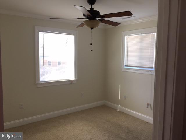7109 Daffodil Lane Newark, MD 21841 - Photo 7 of 21 a view of an empty room with a window